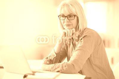 Senior businesswoman working in office