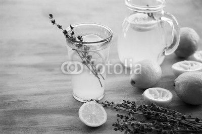 Lemonade with lemons and lavender on gray  shabby table
