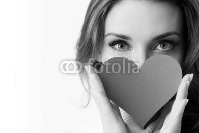 Girl holding paper heart