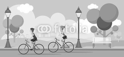 Couple Riding Bicycles In Public Park