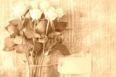 Bunch of yellow roses with blank tag