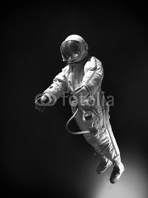 Astronaut in outer space, on a background of blue, infinite spac