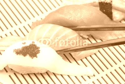 Sushi with black chopsticks