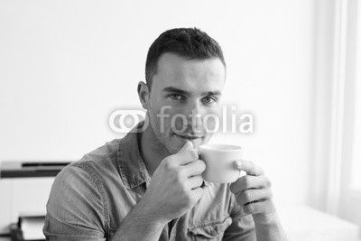 Man in the office with coffee cup