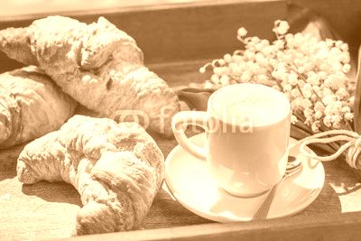 Hot coffee and delicious croissant for breakfast
