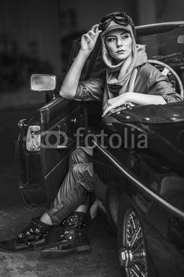 Audrey in an old car