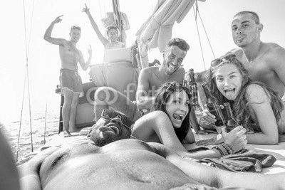 Happy friends taking selfie photo in boat party toasting beer