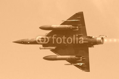 Fast green air force fighter jet flyby