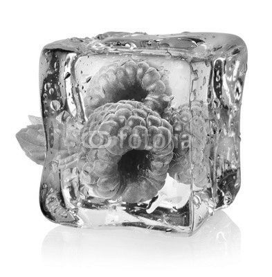 Ice cube and raspberries isolated