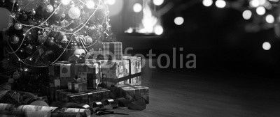 Christmas tree and holidays present on fireplace background