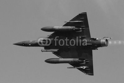 Fast green air force fighter jet flyby