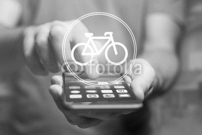 Bicycle icon over device - Sport and technology concept