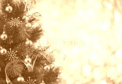 Christmas tree background with gold blurred light