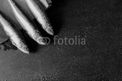 Sardines on dark background