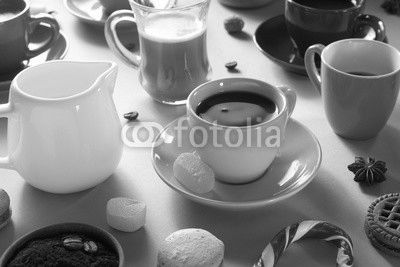 cup of coffee, tea and cacao at purple background