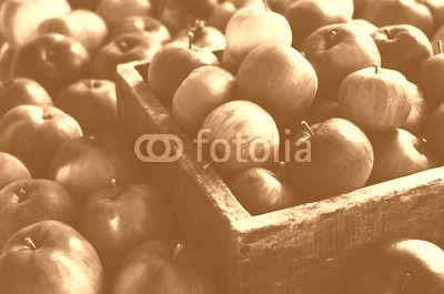 Red autumn apples in farmhouse style wooden crate