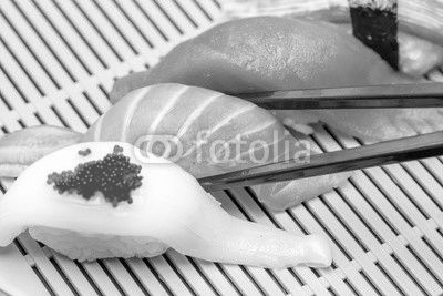 Sushi with black chopsticks
