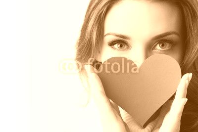 Girl holding paper heart
