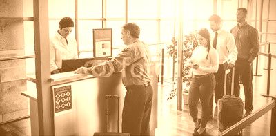 People waiting in queue at airplane counter