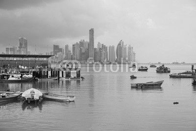 Panama city fishing harbor wharf and boats with skyscrapers buildings in background, Pacific coast of Panama, Central America