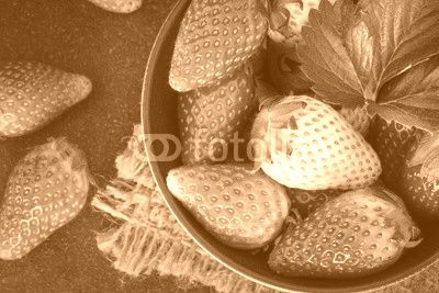  Top view of Red Strawberries and leaf with black stone background