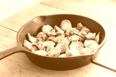 Roasted Brussels sprouts and chestnuts with a balsamic vinegar sauce in a cast iron skillet
