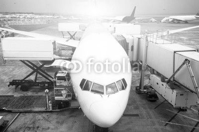 airport with crowded airplanes with sunbeam