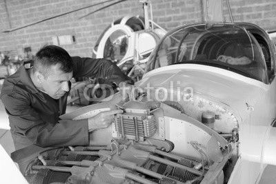 Mechanic working on aircraft