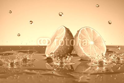 Lime with water drops on grey background