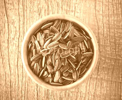 Sunflower seeds in wood bowl