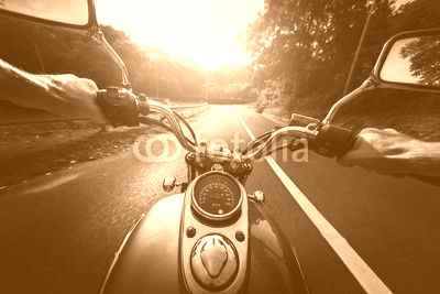Motorcycle on the empty asphalt road
