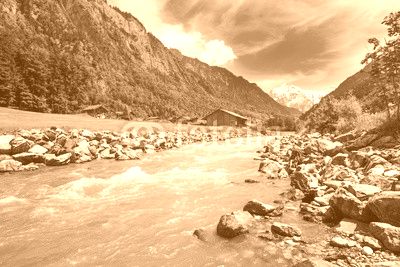 Swiss landscape with river stream and houses