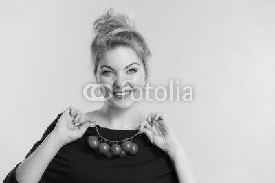 Woman holding fresh cherry tomatoes