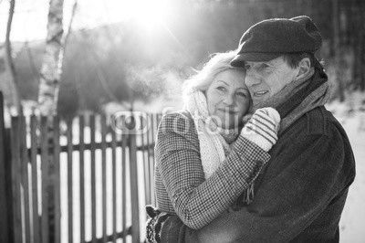 Beautiful senior couple on a walk on sunny winter day