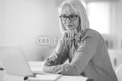 Senior businesswoman working in office