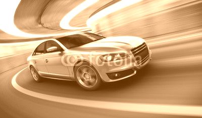 Car driving fast in tunnel