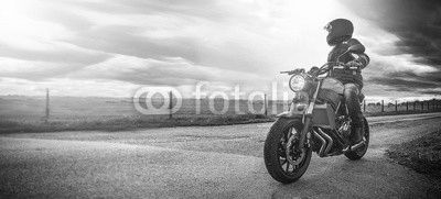 motorbike on the road riding. having fun riding the empty road on a motorcycle tour / journey