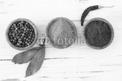 Spices and herbs on wooden background