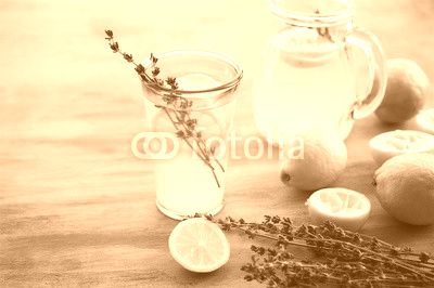 Lemonade with lemons and lavender on gray  shabby table
