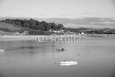View of the Camel estuary at low tide with the touristic village Rock in Cornwall. View from Padstow on the opposite site of the estuary.