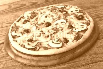 Pizza with seafood on wood table