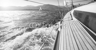 Yacht sailing towards the sunset. Sailing. Luxury yachts.