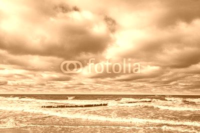 Sandy yellow beach with cloudy sky, Baltic Sea
