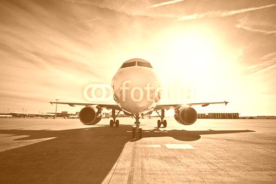 Airplane at the sunrise
