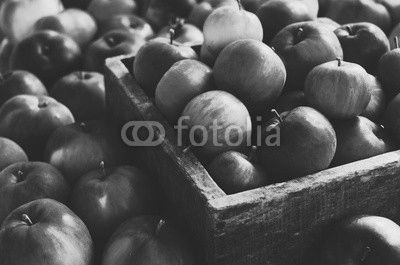 Red autumn apples in farmhouse style wooden crate