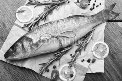 Fresh raw fish and food ingredients on table