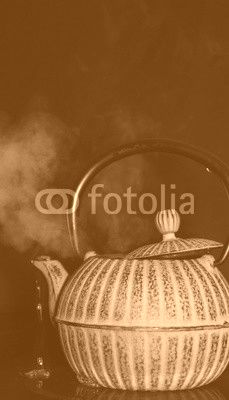 the kettle on the stove on a black background