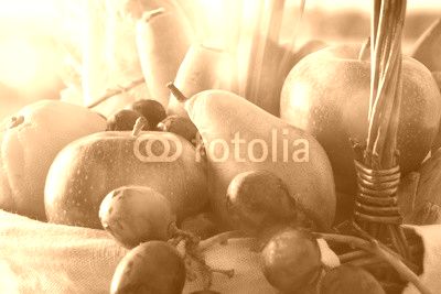Fruits and vegetables in wicker basket front view close up