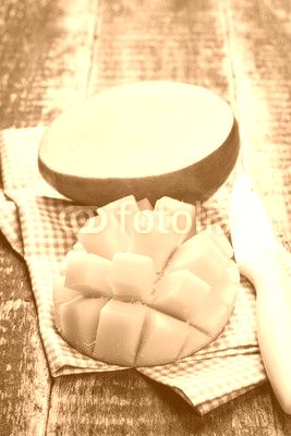 Fresh rip mango on a wooden background.Healthy food