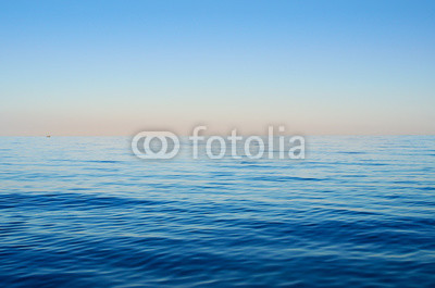 Sea waves on a background of blue sky